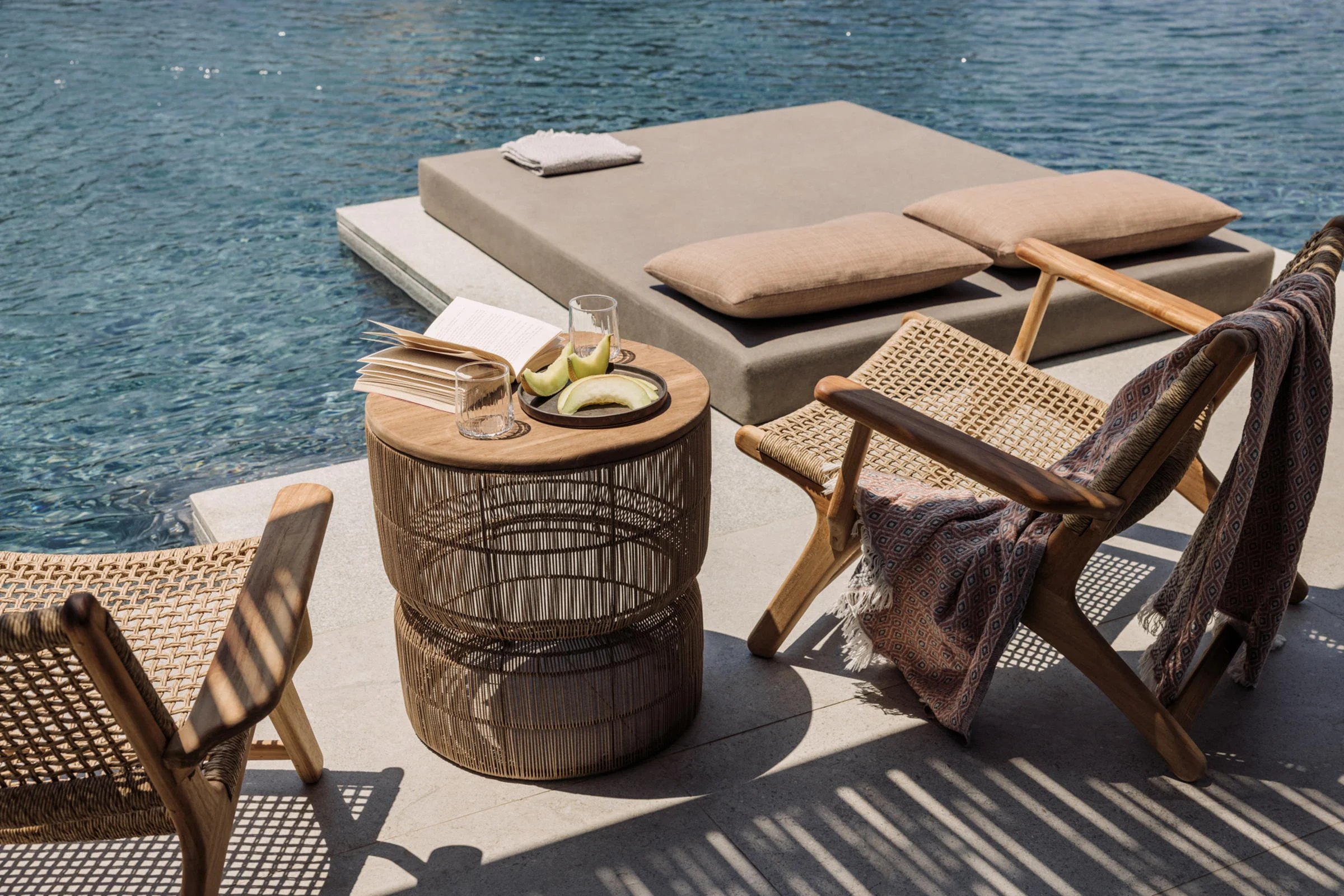 A daybed at the water’s edge