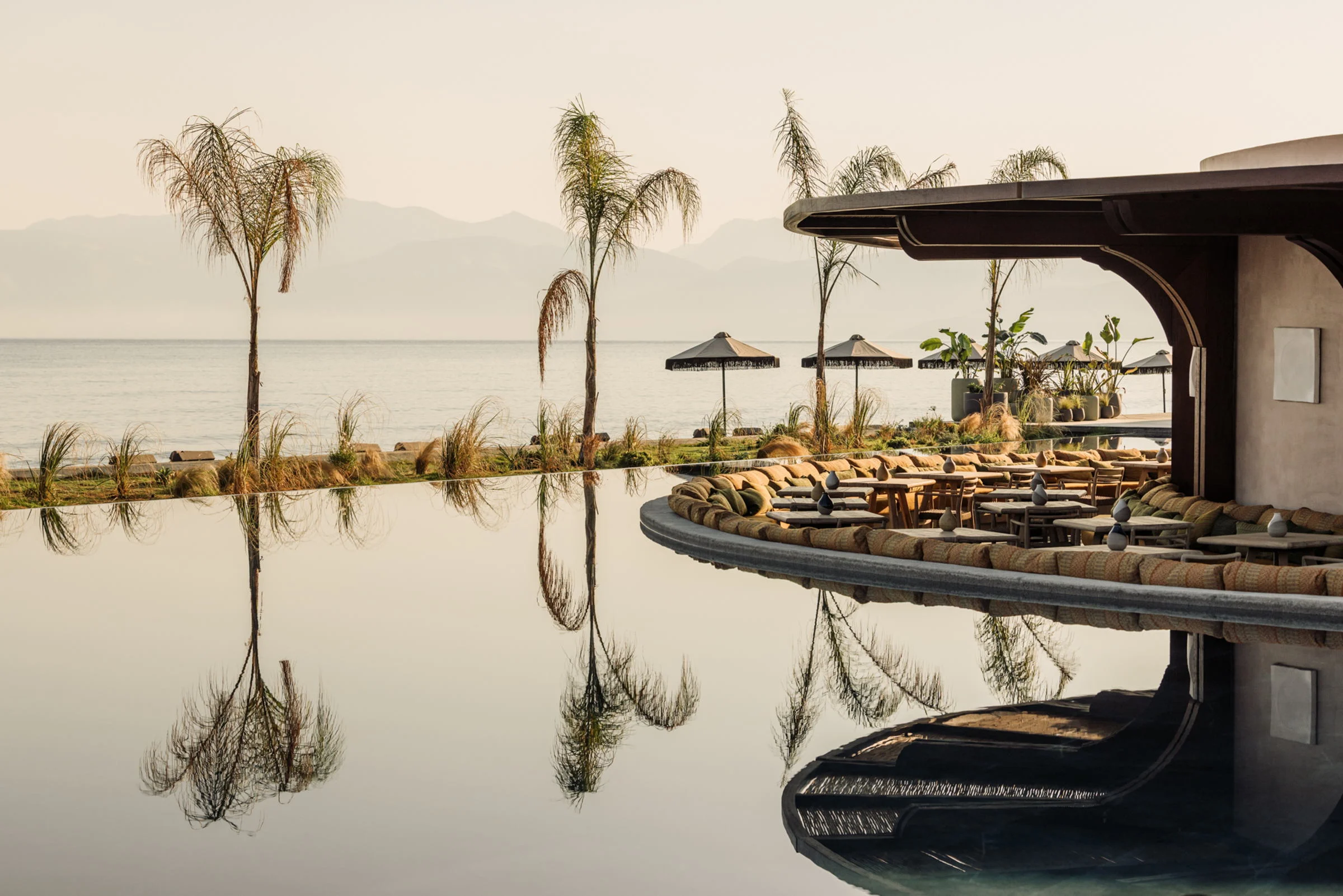 Dining beside the still water of the pool